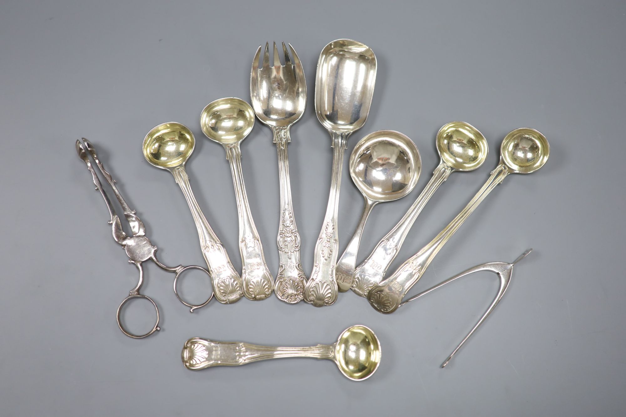 Seven various 19th century silver condiment spoons, a caddy spoon and two pairs of sugar nips including Georgian(a.f.), 8oz.